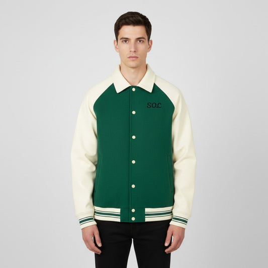 Model wearing the green and apricot SOL Dugout Varsity Jacket, front view with SOL chest print