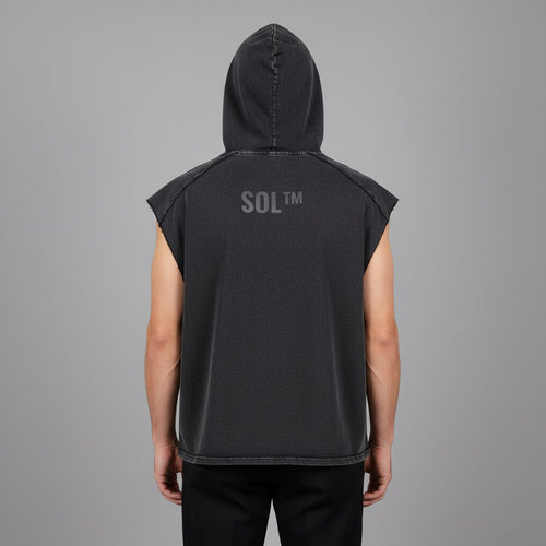 Adult model wearing the charcoal SOL Furnace Hooded Tank, rear view showing the upper-back SOL logo and sleeveless washed fabric.