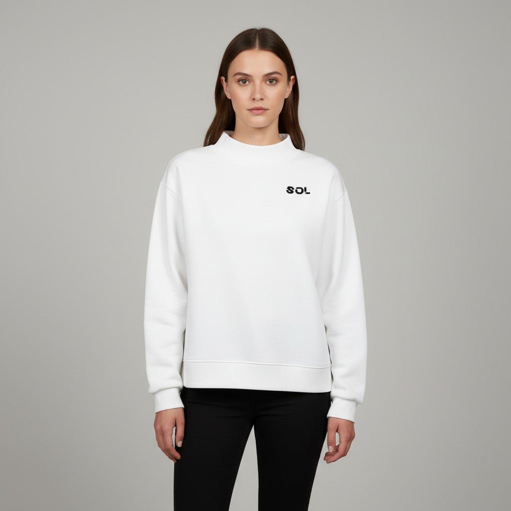 Model wearing the white SOL Halo Mock-Neck Crew with black chest logo