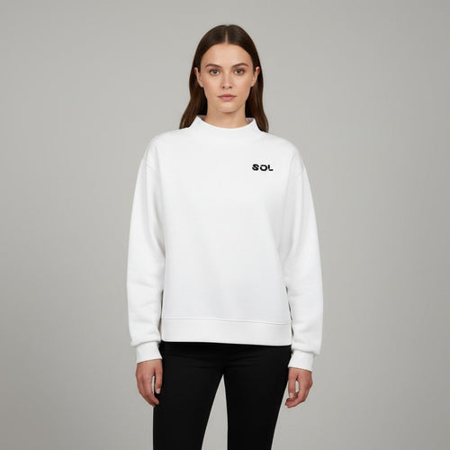 Model wearing the white SOL Halo Mock-Neck Crew with black chest logo