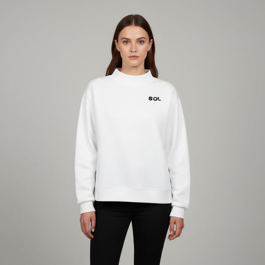 Model wearing the white SOL Halo Mock-Neck Crew with black chest logo