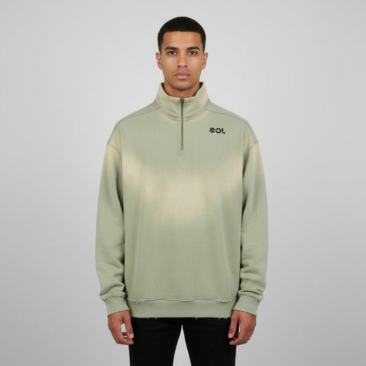 Model wearing gray green SOL Solstice Raw-Edge Quarter Zip with sun-faded wash and chest logo