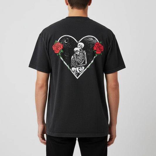Model wearing the black SOL Sunbleach Tee, back view showing skeleton heart and red rose artwork