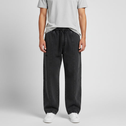 Model wearing black SOL Whiteout Drawstring Pants, front view showing relaxed fit and drawstring waist
